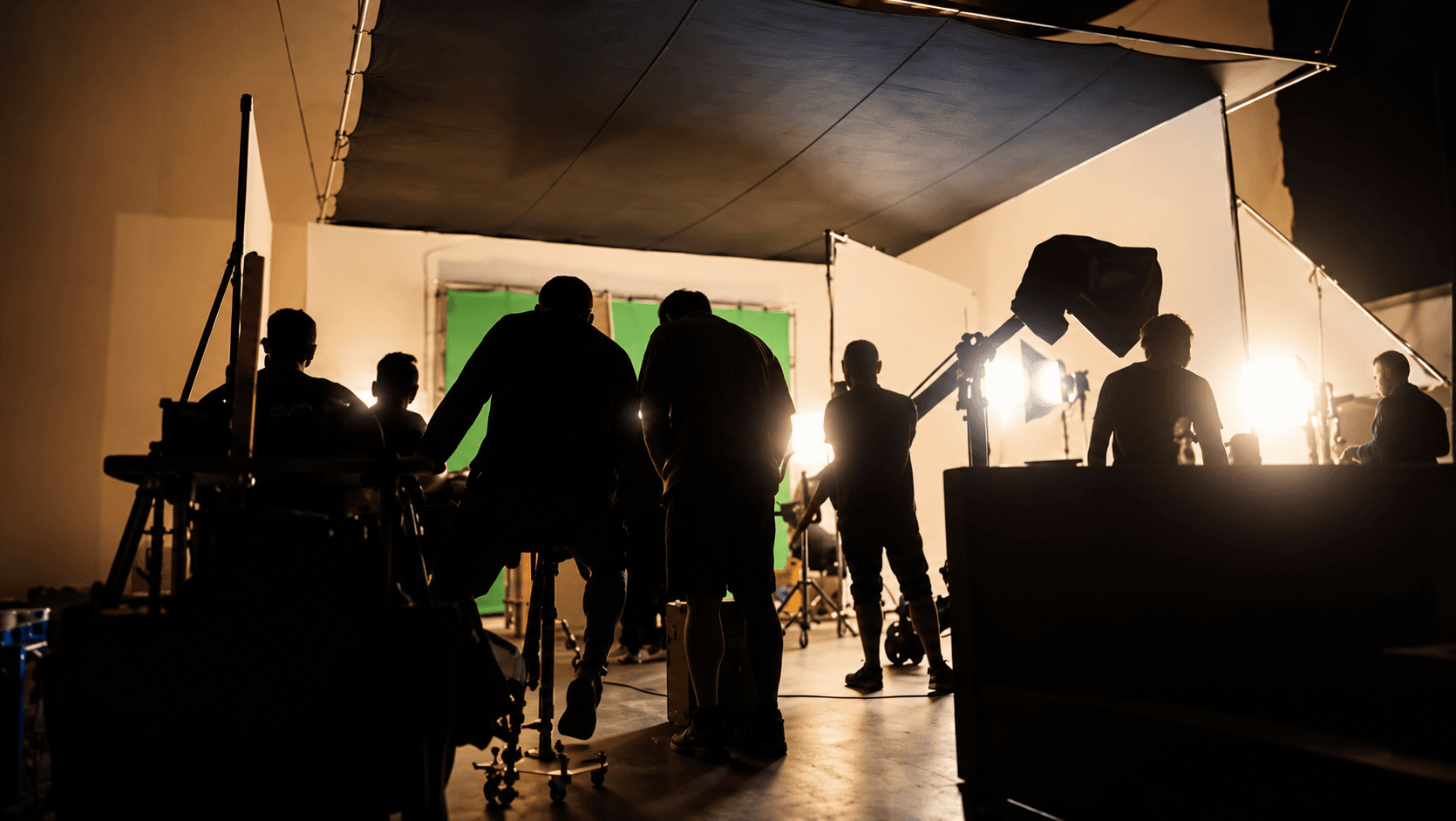 Silhouettes on a Backlit Film Set
